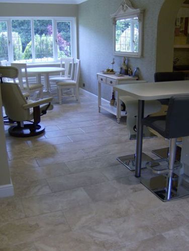 kitchen tiled floor with tables and chairs