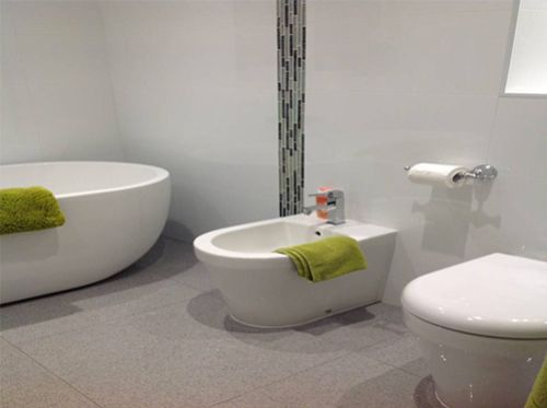 white tiles and toilet
