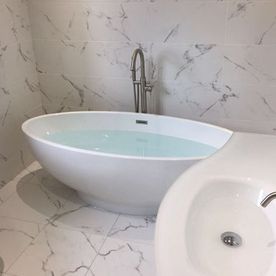 full bath and white tiles.