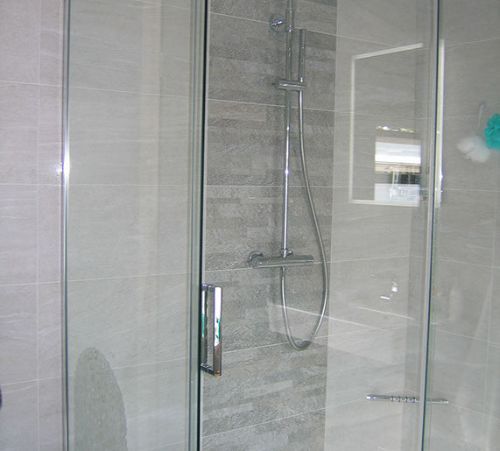 closer shot of shower and tiles 